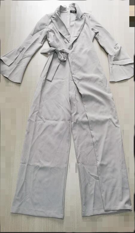 irregular flared sleeve knot side wide leg jumpsuit