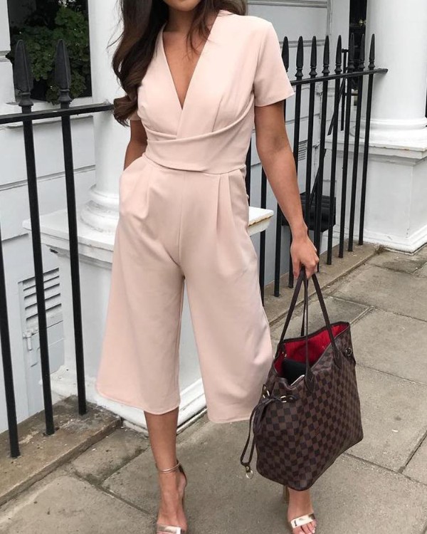 irregular flared sleeve knot side wide leg jumpsuit